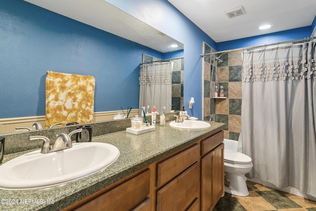 full bathroom featuring toilet, shower / bathtub combination with curtain, and vanity