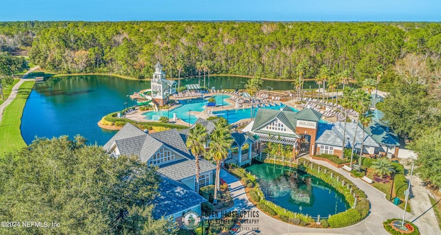 birds eye view of property with a water view