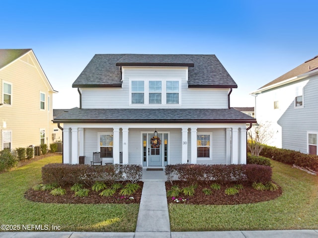 view of front of property with a front lawn and a porch