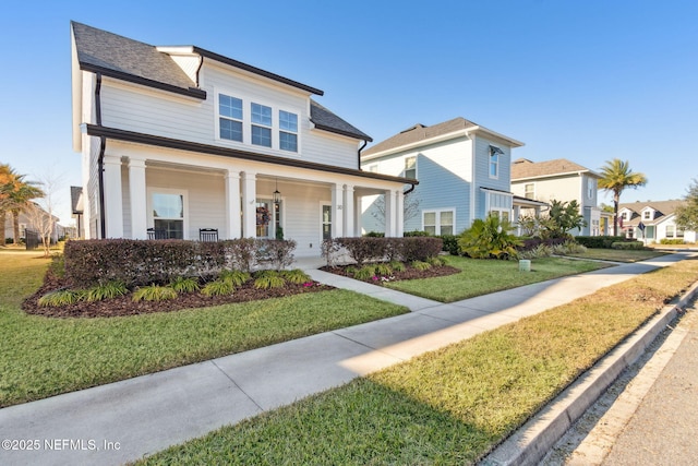 view of front of house with a front lawn and covered porch