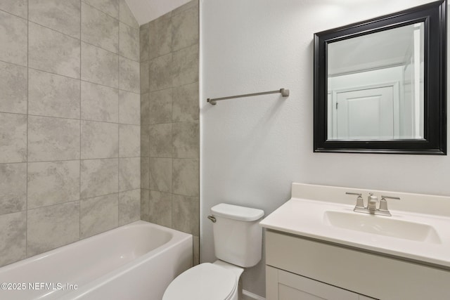 full bathroom featuring tiled shower / bath combo, vanity, and toilet