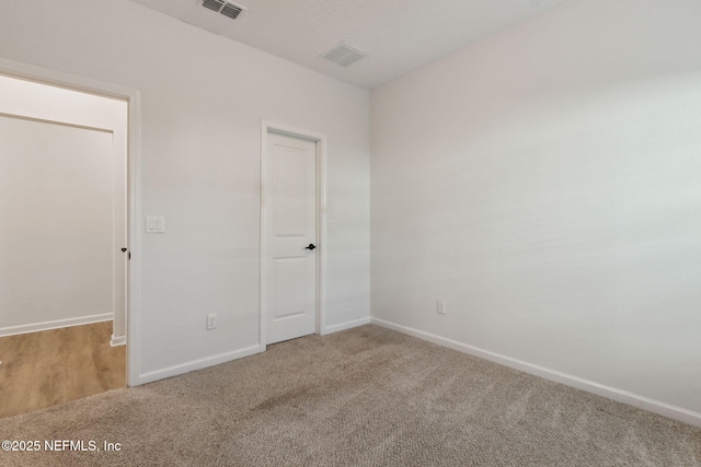 unfurnished bedroom featuring carpet