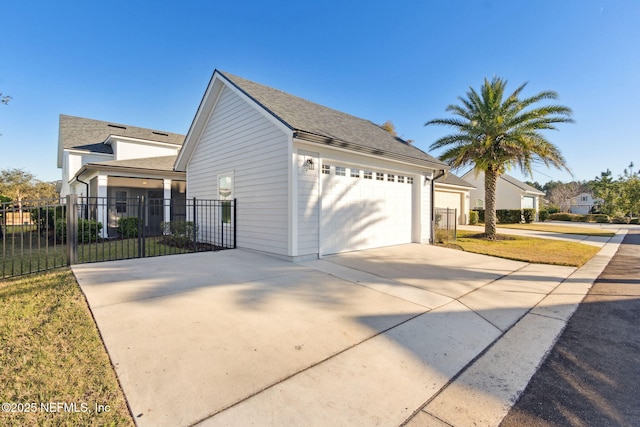 view of side of home with a garage and a yard