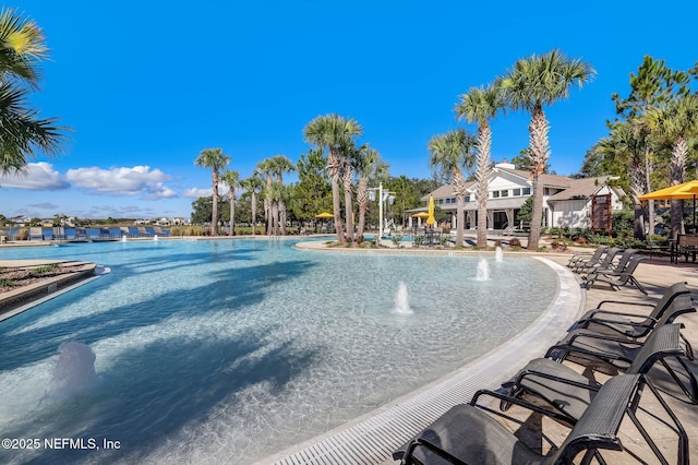 view of pool with pool water feature