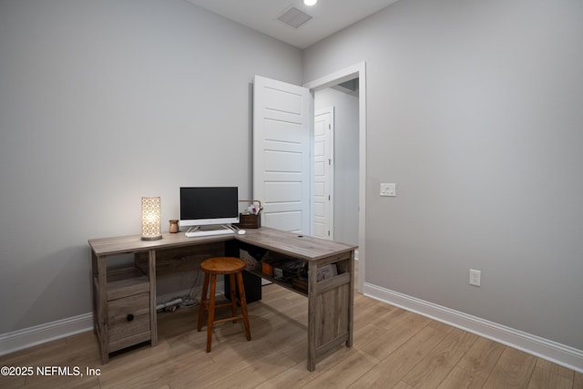 office area with light hardwood / wood-style flooring