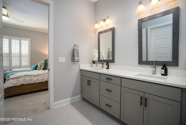 bathroom with ornamental molding, vanity, and tile patterned floors