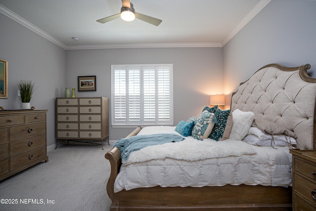 bedroom featuring ornamental molding, light colored carpet, and ceiling fan