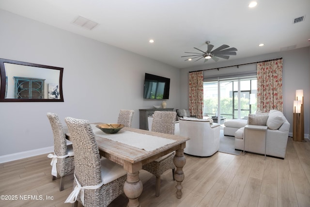 dining room featuring ceiling fan and light wood-type flooring