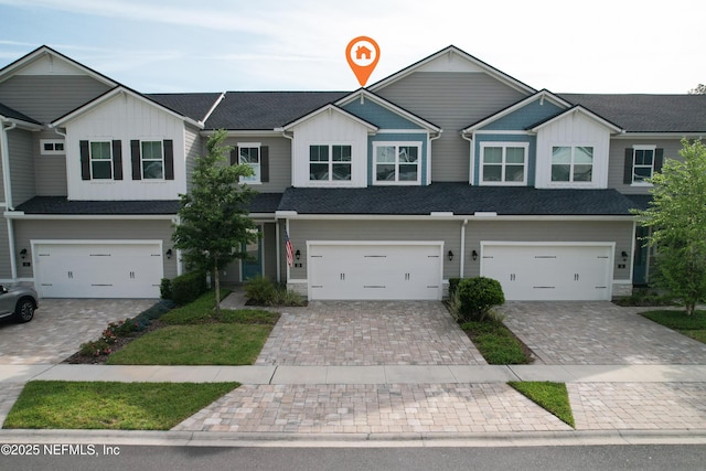 view of front of property with a garage