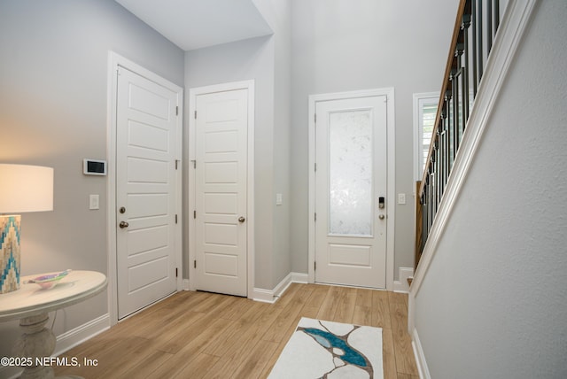 entrance foyer with light hardwood / wood-style flooring