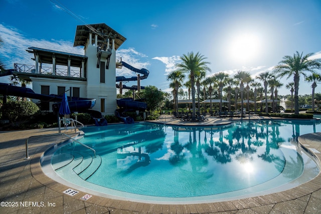 view of swimming pool featuring a water slide