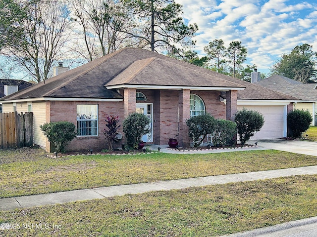 single story home featuring a garage and a front yard