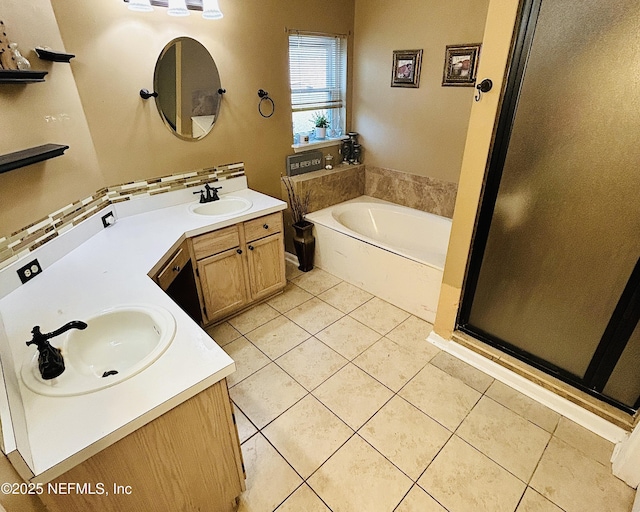 bathroom featuring vanity, tile patterned floors, and a bathing tub