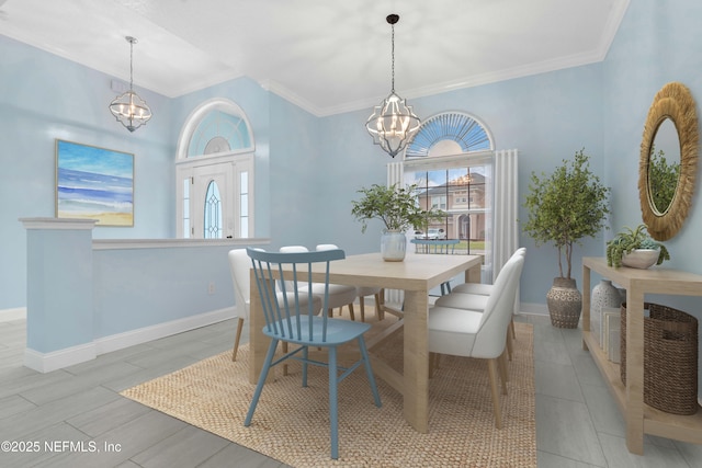 dining space featuring a notable chandelier and ornamental molding