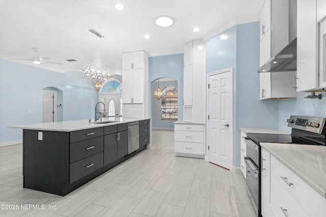 kitchen featuring hanging light fixtures, stainless steel appliances, and white cabinetry