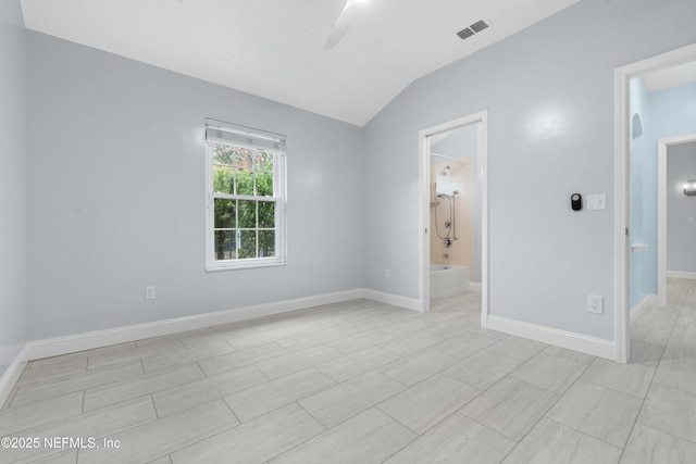 spare room with lofted ceiling and ceiling fan