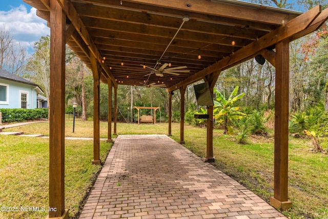 view of patio / terrace featuring ceiling fan