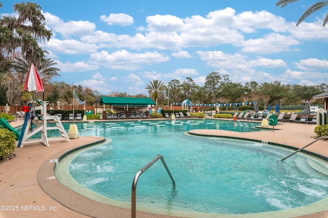 view of swimming pool with a patio area