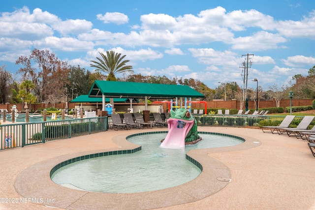 view of swimming pool with a patio