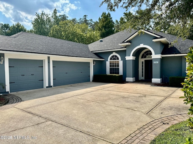 ranch-style house featuring a garage