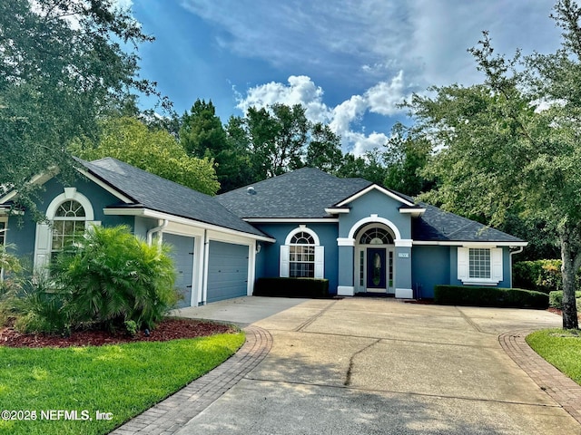 single story home featuring a garage