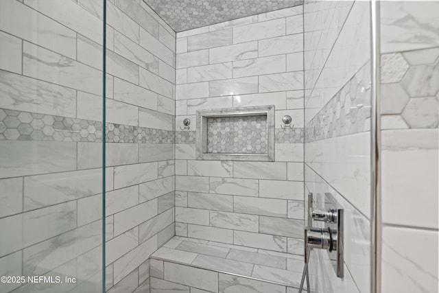 bathroom featuring tiled shower