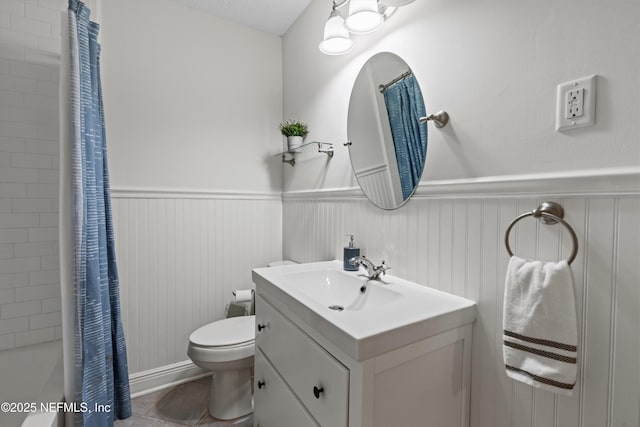 full bathroom featuring tile patterned flooring, vanity, shower / tub combo, and toilet