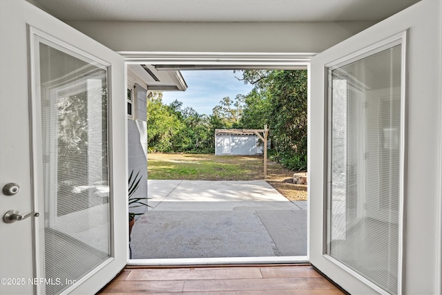 doorway to outside featuring light wood-type flooring