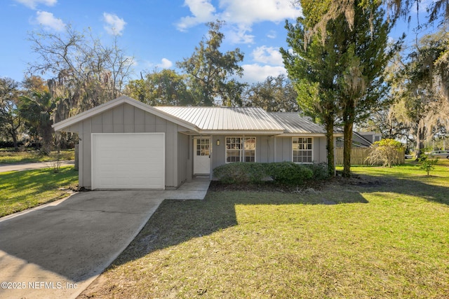 ranch-style house with a front lawn and a garage