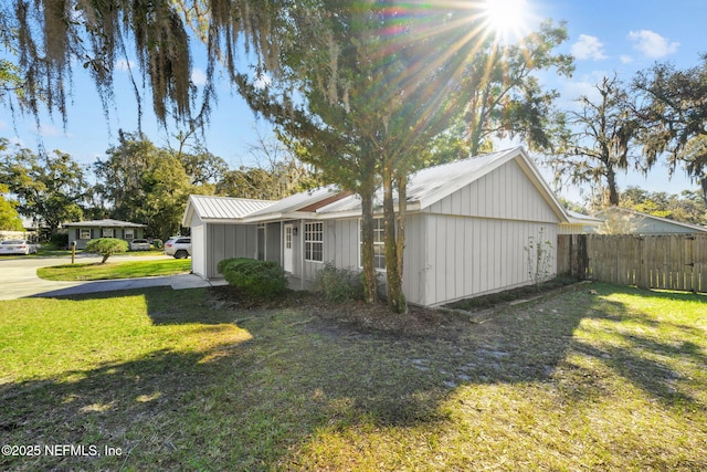 view of home's exterior with a yard