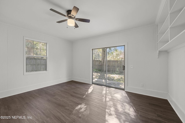 spare room with ceiling fan and dark hardwood / wood-style floors