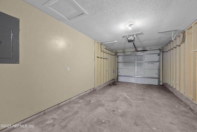 garage featuring electric panel and a garage door opener