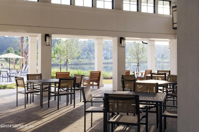 view of patio / terrace featuring a water view and outdoor dining area