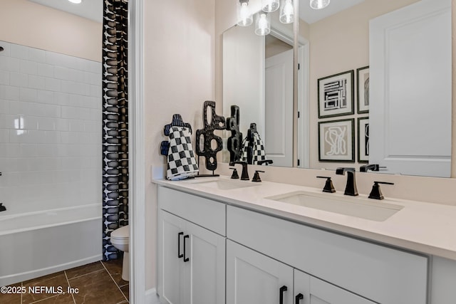 full bath featuring toilet, shower / bath combo, double vanity, and a sink