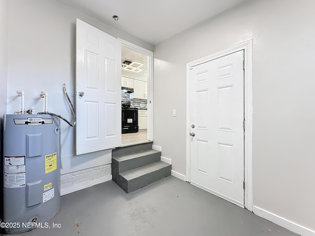 utility room featuring water heater