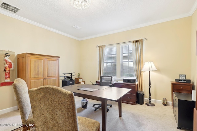 carpeted home office featuring crown molding and a textured ceiling