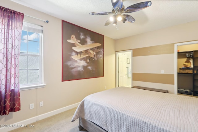 bedroom featuring ceiling fan and carpet flooring