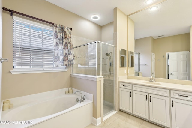 bathroom with vanity, separate shower and tub, and tile patterned flooring