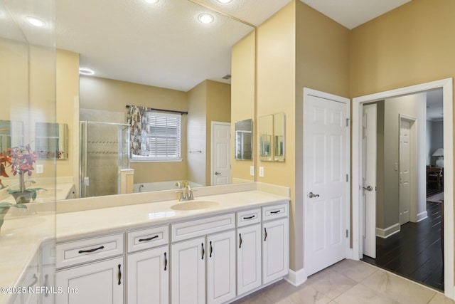 bathroom with vanity and an enclosed shower