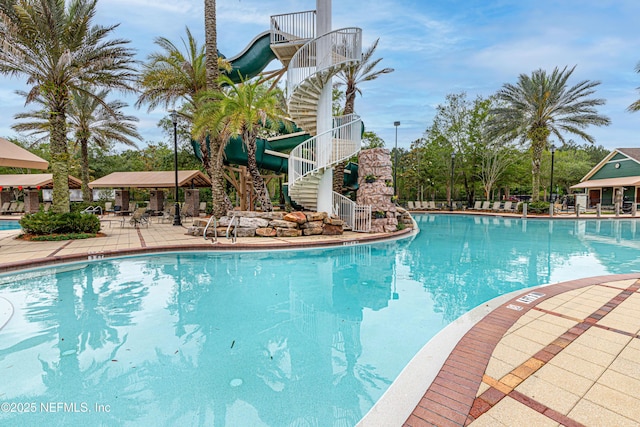 view of swimming pool with a patio