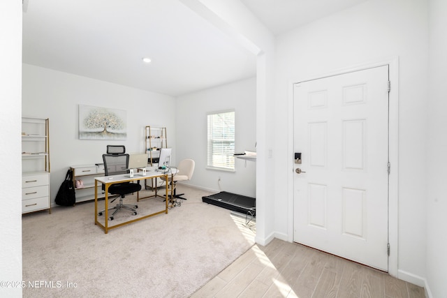 office with light hardwood / wood-style floors