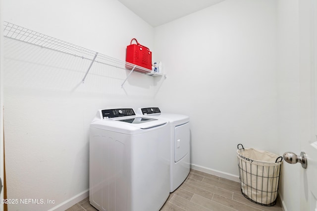 laundry room with washing machine and dryer