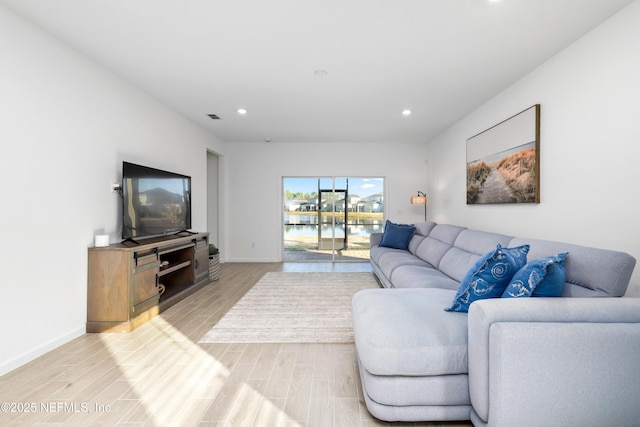 living room with light hardwood / wood-style flooring