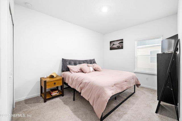 bedroom with light carpet