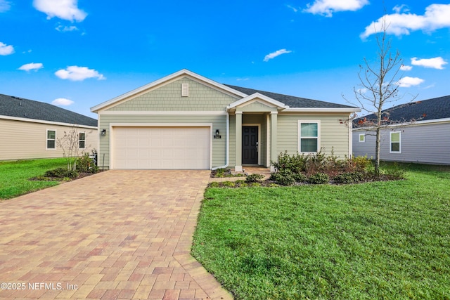 view of front of home featuring a garage and a front yard