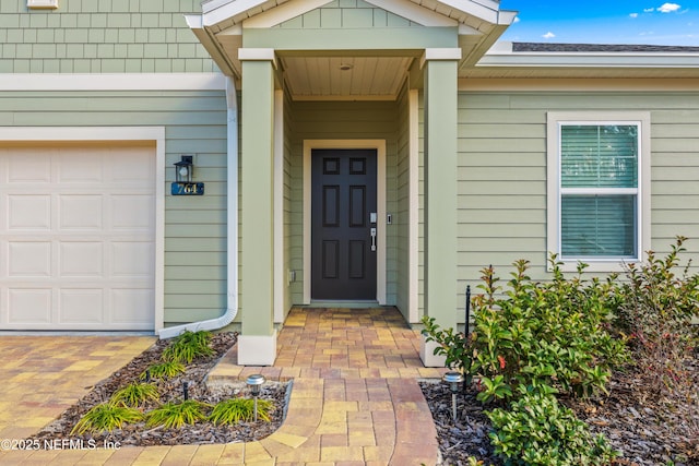 property entrance featuring a garage