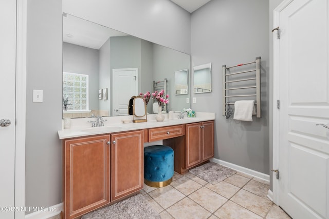 bathroom with vanity, radiator, and tile patterned floors