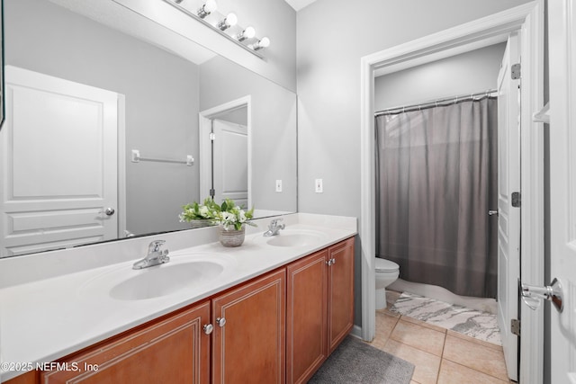 bathroom with vanity, tile patterned flooring, toilet, and a shower with shower curtain