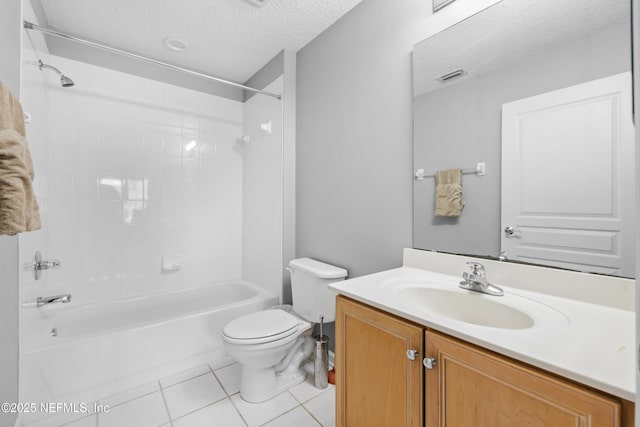 full bathroom featuring toilet, tiled shower / bath, a textured ceiling, vanity, and tile patterned flooring