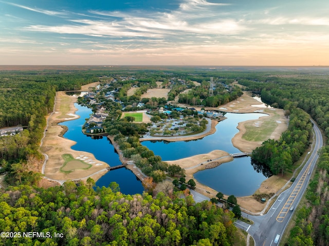 aerial view at dusk with a water view